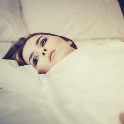 	High-key boudoir portrait.